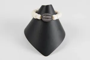 Bone with white topaz bead