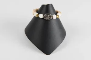 Carved bone and wood with pave diamond bead