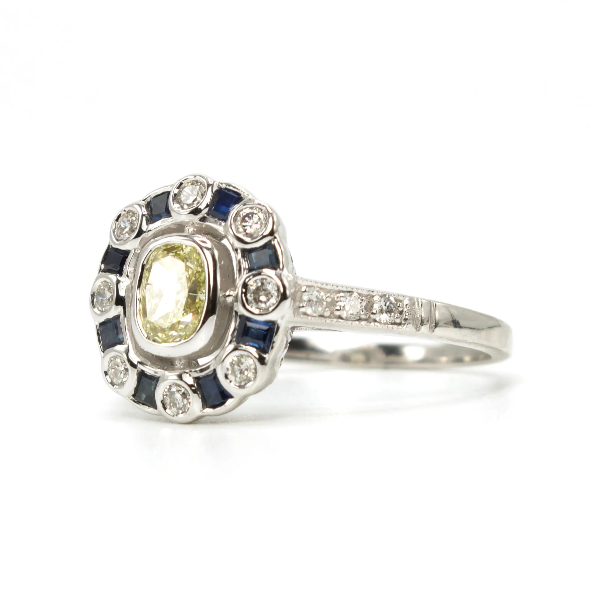 Fancy Yellow Cushion Cut Diamond with Diamond and Sapphire Halo