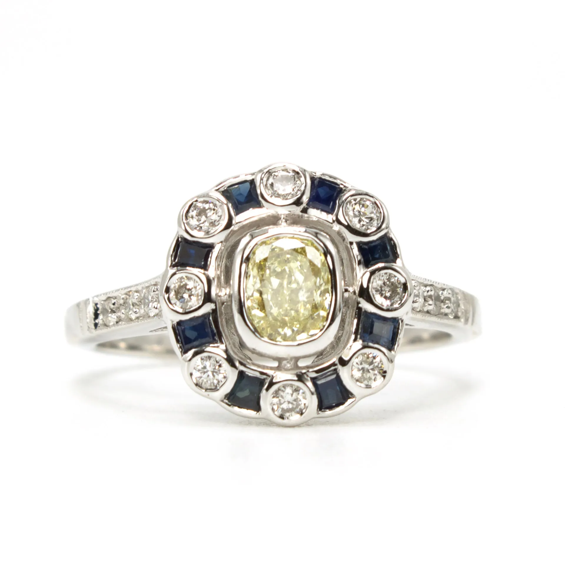 Fancy Yellow Cushion Cut Diamond with Diamond and Sapphire Halo