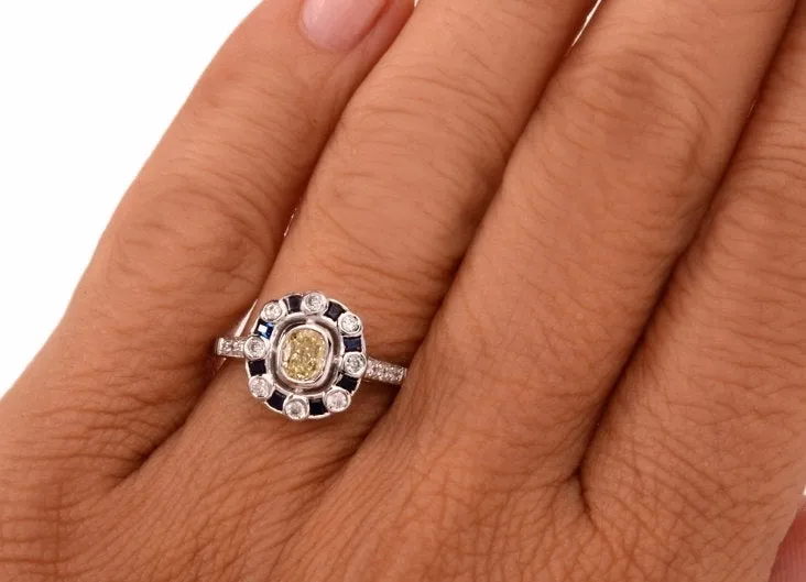 Fancy Yellow Cushion Cut Diamond with Diamond and Sapphire Halo