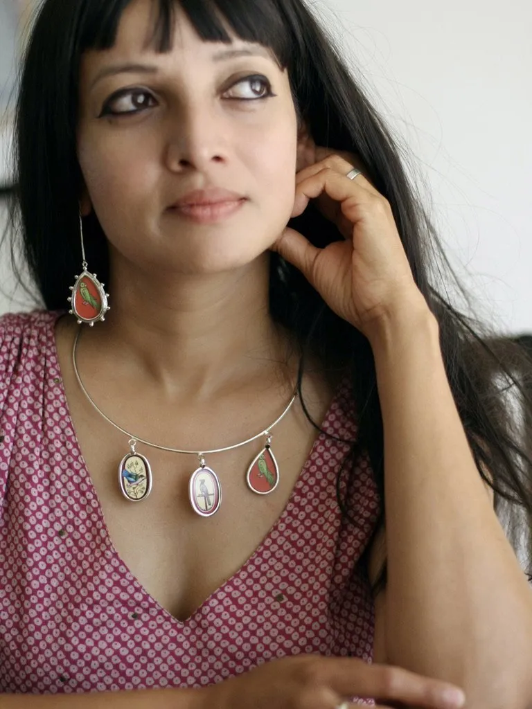 Long, sleek, dangling 'tota' (parrot) earrings