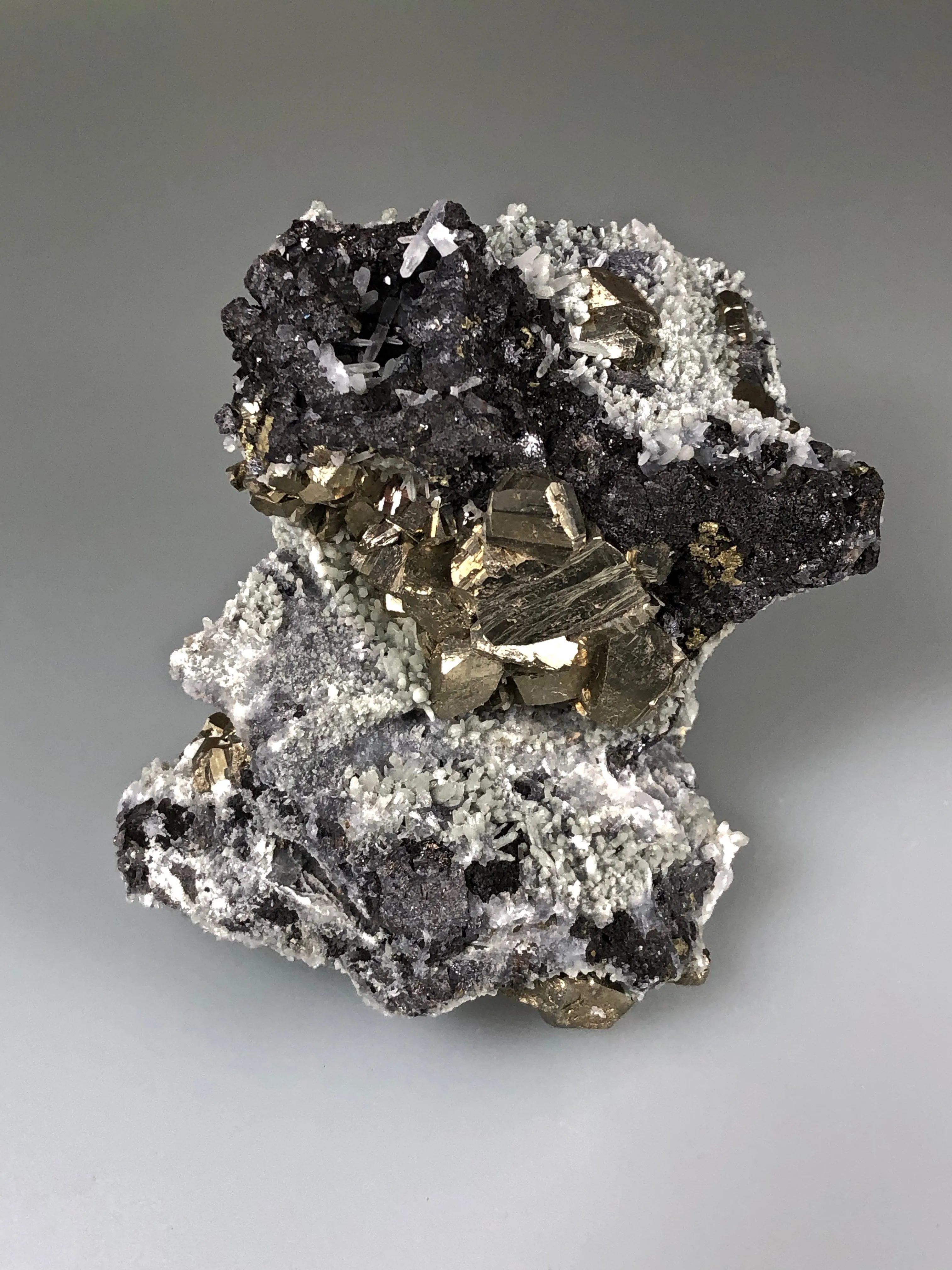 Quartz and Pyrite on Sphalerite, Mogila Mine, Madan District, Bulgaria, Mined c. 2012, Medium Cabinet 6.0 x 9.0 x 12.0 cm, $25.  Online January 30.